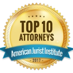 A gold seal that says top 1 0 attorneys american jurist institute 2 0 1 7