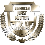 A gold and silver shield with the words american jurist institute top 1 0 attorneys