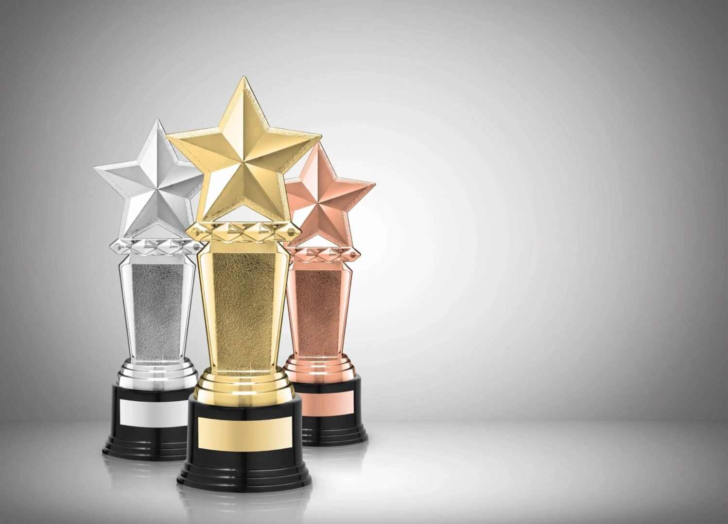 Three awards are shown with a star on top.